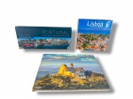 LIVROS, três (3) livros ilustrados/fotográficos, composto por: Portugal Encantado, de Pedro Rodrigues; Lisboa Vista do Ar / From the Air / Vue des Airs, edição Flying Book House; e Portugal Panorâmico, de Nuno Cardal, edição Lidel. Obras com fotografias de paisagens, cidades, monumentos e vistas aéreas de Portugal e Lisboa.