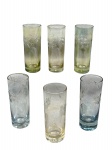 VIDROS, seis (6) shots confeccionados em vidro nacarado com lapidação de elementos florais e vegetalistas em baixo relevo, medindo 11x4cm.