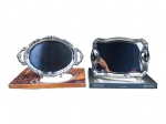 METAL INOX, lote com duas (2) bandejas confeccionadas em aço inox, sendo: A) WOLFF, modelo mariana, decorado por arabescos recortados na borda, sem uso, medindo 39,5x25,5cm e B) TRAMONTINA, 1 bandeja, modelo Classic, medindo 35x24cm, sem uso.