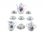 SCHMIDT - Aparelho para café em porcelana branca, composto por quinze (9) peças, sendo: um (1) bule , med : 19 cm,  uma (1) leiteira, med : 10 cm , um (1) açucareiro , med : 10 cm  e seis (6) xícaras para café com seus respectivos pires , med : 4 cm . Decoração policromada com motivos florais em tons de rosa, azul, amarelo e verde, detalhes em relevo no corpo das peças, alças trabalhadas e frisos dourados nas bordas