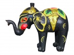ESCULTURA, uma (1) escultura confeccionada em madeira entalhada com pintura preta representando elefante, decoração policromada e em vasta douração, ausência das presas, pernas com fissuras, vide foto, medindo 24,5x30cm.