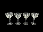 VIDRO - Lote com quatro (4) taças para água em vidro translúcido, medida: 14,5 cm , com bojos lapidados em gomos, hastes alongadas e bases circulares.
