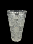 CRISTAL, um (1) vaso confeccionado em cristal translucido com lapidação de palmas, caneluras, estrelas, pingos de diamante e elementos geométricos em baixo relevo com fundo estrelado, apresentando bicado na base, medindo 23x14cm.
