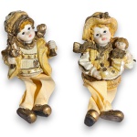 SANTINI - GRUPO ESCULTÓRIO NATALINO, EXECUTADO EM RESINA E TECIDOS, REPRESENTANDO DUAS FIGURAS INFANTIS TRAJANDO VESTES TEMÁTICAS NATALINAS EM TONS DOURADOS, SENDO UMA PORTANDO SINO E ÁRVORE DE NATAL E OUTRA COM BONECA E PRESENTE, COM PERNAS FLEXÍVEIS E PENDENTES EXECUTADAS EM TECIDO ACETINADO, MODELO TIPO SHELF SITTER, PRÓPRIO PARA APOIO EM PRATELEIRAS E ESTANTES, MEDINDO 19 X 8 X 4,5 CM CADA. APRESENTAM MARCAS DO TEMPO, USO, DESGASTES, SUJIDADES, PEQUENAS AVARIAS E/OU IMPERFEIÇÕES COMPATÍVEIS COM SUA UTILIZAÇÃO E ESTADO DE CONSERVAÇÃO, CONFORME FOTOS EXTRAS.