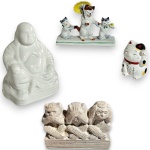 CONJUNTO DE ESCULTURAS EXECUTADAS EM MATERIAIS, TÉCNICAS, MODELOS, FORMATOS, TAMANHOS E PROCEDÊNCIAS DIVERSOS, COMPOSTO POR QUATRO PEÇAS, SENDO: GRUPO ESCULTÓRIO EM RESINA, REPRESENTANDO OS TRÊS MACACOS DA SABEDORIA, MEDINDO 6 X 9 X 3,5 CM; UMA EM PORCELANA VITRIFICADA E ESMALTADA, REPRESENTANDO GATO DA SORTE ORIENTAL, MEDINDO 4,5 CM; GRUPO ESCULTÓRIO EM PORCELANA, REPRESENTANDO FAMÍLIA DE GATOS, MEDINDO 7 X 9,5 X 2,5 CM E ESCULTURA EM PORCELANA ESMALTADA, REPRESENTANDO BUDA, MEDINDO 9 CM. APRESENTAM MARCAS DO TEMPO, USO, PEQUENOS RISCOS, DESGASTES, PEQUENAS AVARIAS, PERDAS E/OU IMPERFEIÇÕES COMPATÍVEIS COM SUA UTILIZAÇÃO E ESTADO DE CONSERVAÇÃO, CONFORME FOTOS EXTRAS.