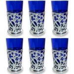 CONJUNTO PARA BEBIDAS EXECUTADO EM MATERIAIS, TÉCNICAS, MARCAS, MODELOS, MEDIDAS, FORMATOS, TAMANHOS E PROCEDÊNCIAS DIVERSOS, COMPOSTO POR TREZE PEÇAS, SENDO: SETE PORTA-COPOS EM METAL RICAMENTE ORNADOS EM ALTO RELEVO VAZADO APRESENTANDO VOLUTAS E DECORAÇÃO FITOMÓRFICA, MEDINDO 8,5 X 6,5 CM CADA E SEIS COPOS EM VIDRO COLORIDO, MEDINDO 11,5 X 6 CM CADA. APRESENTAM MARCAS DO TEMPO, USO, PEQUENOS RISCOS, MANCHAS, PEQUENOS DESGASTES E/OU IMPERFEIÇÕES COMPATÍVEIS COM SUA UTILIZAÇÃO E ESTADO DE CONSERVAÇÃO, CONFORME FOTOS EXTRAS.