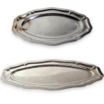WOLFF - CONJUNTO, PARTE DE SERVIÇO DE MESA EXECUTADO EM AÇO INOXIDÁVEL, DE FORMATO OVALADO COM REBAIXO ESCALONADO INTERNO, BORDA RECORTADA E MOLDADA, COMPOSTO POR DUAS TRAVESSAS, SENDO: UMA, MEDINDO 60,5 X 32 CM CADA E UMA, MEDINDO 41 X 28 CM. APRESENTAM MARCAS DO TEMPO, USO, PEQUENOS RISCOS, MANCHAS, PEQUENOS DESGASTES E/OU IMPERFEIÇÕES COMPATÍVEIS COM SUA UTILIZAÇÃO E ESTADO DE CONSERVAÇÃO, DESTACANDO DANO DE QUEIMADO NA MENOR, CONFORME FOTOS EXTRAS.