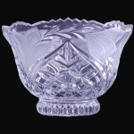 FRUTEIRA EXECUTADA EM GROSSO DEMI-CRISTAL MOLDADO E LAPIDADO, COM CORPO CIRCULAR DECORADO POR PADRÕES GEOMÉTRICOS, LAPIDAÇÕES FACETADAS, SULCOS E MOTIVOS EM ESTRELA EM RELEVO, APRESENTANDO BORDA SUPERIOR ONDULADA, ABAS EXPANSÍVEIS REVERSAS SOBRE BASE EM CANELURFAS, MEDINDO 9,5 X 15 CM. APRESENTA MARCAS DO TEMPO, USO, DESGASTES E/OU IMPERFEIÇÕES COMPATÍVEIS COM SUA UTILIZAÇÃO E ESTADO DE CONSERVAÇÃO, CONFORME FOTOS EXTRAS. ESCLAREÇA TODAS AS DÚVIDAS ANTES DE EFETUAR SEU LANCE, QUE SERÁ CONSIDERADO IRREVOGÁVEL E IRRETRATÁVEL. CONSULTE PREVIAMENTE OS TERMOS E CONDIÇÕES DISPONÍVEIS NO SITE. CONTATO (21) 98264-3000.