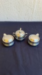 DIVERSOS - Lote com 2 itens ( 3 Peças) - Item 1 Par de cremeiras Backer Brazil de aço inox 18/10 com aproximadamente 7,5cm de altura e 10cm de diâmetro; Item 2 Um açucareiro de aço inox de aproximadamente 9cm de diâmetro e 10cm de altura | Obs: Os itens possuem alguns pontos de oxidação pequenos.