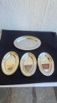 DIVERSOS - Conjunto com 4 travessas de aço inox, com uma delas medindo 35x23,5cm, e as outras 3 medindo 25x7cm. Todos os Itens possuem marcas de uso.