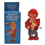 Brinquedo vintage de humor adulto, conhecido como "Happy Jerk-Off Clown", comercializado em sex shops durante a década de 1980. O boneco funciona a corda e apresenta movimentos manuais explícitos, sendo um item de coleção considerado "X-Rated". Acompanha caixa original com a descrição do produto.
