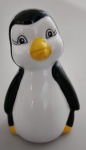 Escultura em ceramica representando pinguim , com pé e bico na cor amarelo . Medindo : 9 cm.