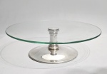RIVA SILVER SPECIAL - Prato alto para servir sobremesa em vidro temperado e base em metal silverplate (folheado a prata). Sem uso. Med. 30 x 9 cm