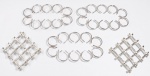 Lote com 4 suportes para travessas em metal folheado a prata cinzelados em volutas e 2 extensivos no formato de galhos de bambus. Sem uso.  Med. 30 x 17 cm cada e 18 x 18 cm fechados.