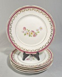 Lote com 5 pratos rasos em porcelana Schimidt decorados com flores e frisos dourados. Med.