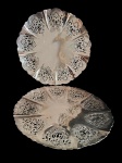 Wolff- Duas fruteiras/ centro de mesa em metal espessurado a prata, sobre pés tripoides, bordas onduladas e decoração fenestrada.  Medindo: 29,5 x 4,5 e 30 x 3 cm.