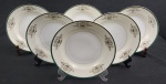 DRAGON CHINA JAPAN. Seis pratos fundos em porcelana japonesa, decoração floral e filetes em ouro, com listra verde sobre fundo marfim e branco. Manufatura no verso. Med.: 4 x 23,5 cm diâm.