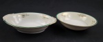 DRAGON CHINA JAPAN. Duas saladeiras em porcelana japonesa, decoração floral e filetes em ouro, com listra verde sobre fundo marfim e branco. Manufatura no verso. Med.: 6 x 23 cm e 6 x 27 x 19,5 cm. Fio de cabelo em um e desgastes.
