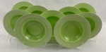 GRINDLEY, Inglaterra. Nove pratos fundos em faiança inglesa na cor verde, de desenho característico Art Déco, com decoração concêntrica em relevo. Manufatura no verso. Med.: 4 x 23 cm diâm.