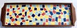 Bandeja em madeira nobre com trabalho de mosaico em policromia ao centro. Med 38 x 13 cm. 