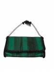 Antiga bolsa de mão feminina , produzida em pano e alça de metal.