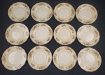 GRINDLEY, Inglaterra. Doze pratos para sobremesa em faiança inglesa esmaltada, decoração floral em policromia sobre fundo bege e amarelo, detalhes a ouro. Marcado. Cerca de 1900. Medindo: 17 cm. 1 com bicado.