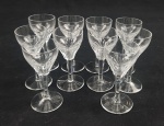Dez (10) taças para licor em cristal incolor, lapidado à mão com caneluras e coluna facetada. Medida: 10,5 x 5 cm.