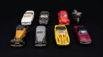 Sete carros e uma moto em miniaturas em ferro. Med.: 4x5x12cm cada carro. Med.:5x3x9 cm moto.