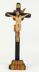 Escultura em madeira pintada com imagem de Jesus Cristo crucificado. Med.: 33x5,5x13cm.