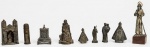 Nove peças sacras em metal. Med. peça maior: 9cm; peça menor: 2,5cm.