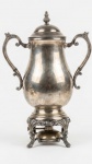 Samovar espessurado a prata da marca F.B. Rogers. Med.:38,5cm de altura e 27,5cm de diâmetro.