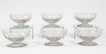 BACCARAT - Conjunto com 6 taças para champagne em cristal françês, haste curta e lapidação de facetas contínuas, modelo CHARLES  com carimbo da cristaleria na base. 6 x 10 cm.