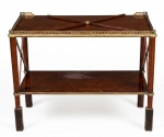Mesa de apoio em madeira nobre estilo Georgiano com dois níveis , unidos por colunas caneladas, amarradas no formato de X, tampo superior com cercadura vazada em bronze. Pés em bloco rústico de madeira. 80 x 33 x 67 cm.