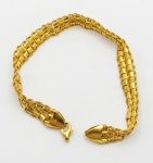 Pulseira Taparella em ouro 750 marcado em uma das extremidades. Elo do fecho, partido. 19 cm. Peso: 7.6g.