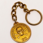 Colecionismo. Chaveiro antigo, década de 60, Scuderie Detetive Le Cocq. Metal dourado, sem uso.