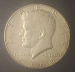 Estados Unidos - Kennedy Half Dolar 1965 - Prata (0.400) 11,5 g - 30,61 mm.