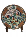 Antigo prato em porcelana oriental , familia galo, medindo 26 cm , pequena lasca conforme foto