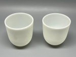 Acabamentos de lustre em demi cristal leitoso fosco, lote com 2 unidades, medidas 8x7 cm. Apresentam marcas do tempo, uso e bicados. Trincado.
