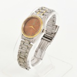 RELÓGIO, um (1) de pulso, marca ORIMET, quartz, caixa e pulseira em aço com detalhes em dourado, medindo 33 mm diâmetro, usado, não testado e sem garantia, possivelmente demanda bateria, vide foto.