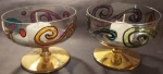 Par de Luminárias  em demi cristal com base douradas e trabalhadas na arte vitral medindo 10x8 cm. Acompanha vela..