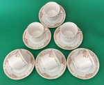 Jogo de seis xícaras de café em porcelana branca com flores , barrado e filetes dourado medindo 6x4 e 12 cm.