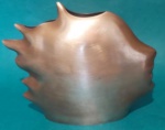 Escultura de rosto de homem em bronze medindo 16x18 cm.