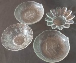 Quatro petisqueiras em vários estilos e modêlos em vidro medindo entre 14 e 15 cm.