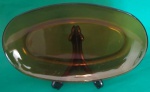 Travessa oval em Duralex marrom medindo 33x21cm.
