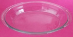 Travessa funda Colorex oval transparente medindo 35x22 cm.