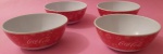 Quatro bowls Coca-cola redondo medindo 12x6 cm.