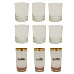 Lote constando de 9 copos sendo: A) Conjunto  de 3 copos para long drink apresentando decoração central com carrinhos de corrida e borda com friso dourado. Ocean Thailand. 14 cm. B) Conjunto de 6 copos translúcidos e lisos No fundo marca de origem (10 x 8 cm).