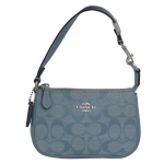 COACH  Mini bolsa de mão modelo Signature Chambray padrão de estampa Corn Flower. Bolsa nova, sem uso