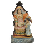 Imagem representando SantAna Mestra em madeira esculpida e policromada com dourado. 24 x 14 x 10 cm.