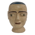 Ex-Voto - Escultura em monobloco em madeira policromada. Brasil. Séc. XX. 44 x 25 cm. Apresenta pequeno bicado.